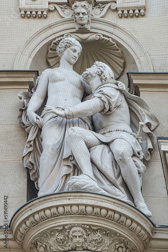 Vienna, Austria - Wall sculpture of woman and man located in museums district, downtown of Vienna, Austria