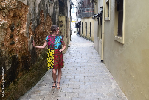 Girl poses in ancient Stone Town, Zanzibar street