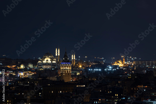 Galata tower in Istanbul, Turkey. Aerial view of landmark at golden hour with beautiful sunlight. Snow and winter season view in Istanbul Suleymaniye Mosque and Galata tower. © mehmet