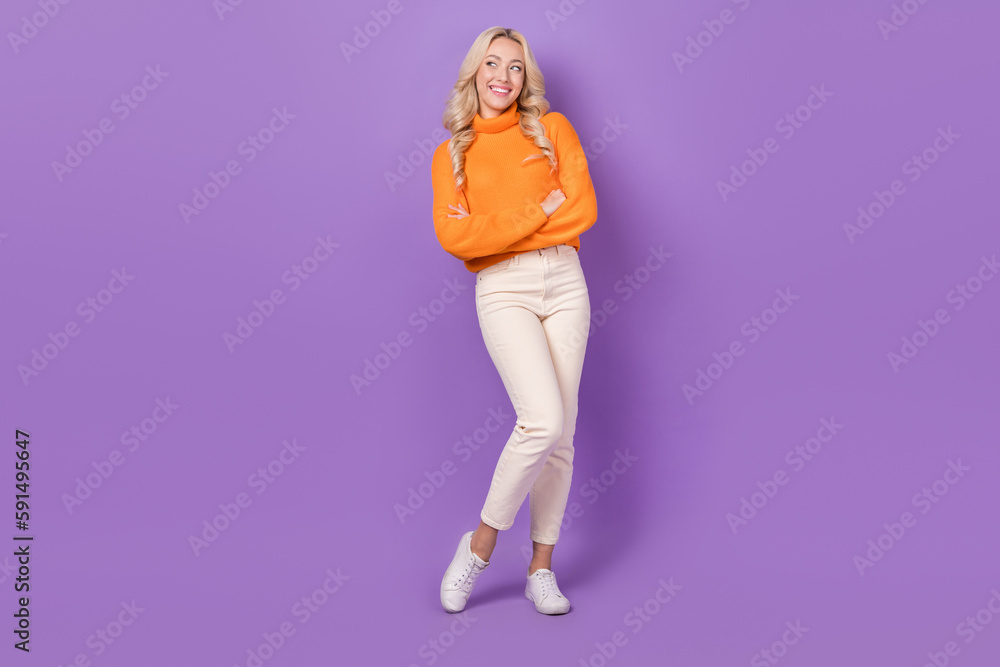 Full size portrait of positive nice girl folded hands look interested empty space isolated on purple color background Full size portrait of positive nice girl folded hands look interested empty space isolated on purple color background