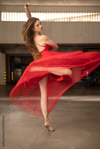 beautiful ballerina turning around in a red dress, dancer in studio, young latin woman with long hair, healthy lifestyle with activity, preformance photo