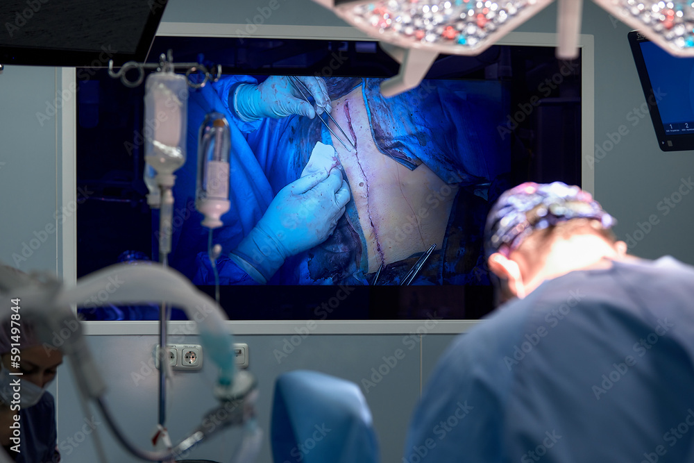 Portrait of a male surgeon in the operating room on the background of ...