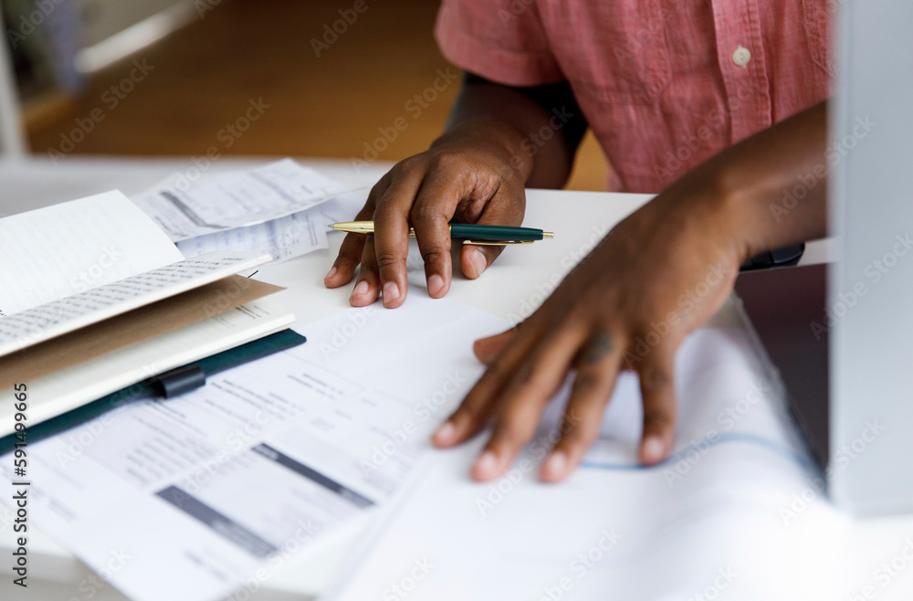 Freelancer examining financial bills at home Freelancer examining financial bills at home