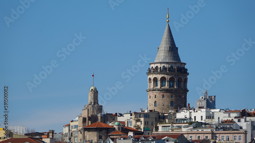 Istanbul city skyline in Turkey, Beyoglu district old houses with Galata tower on top, view from the Golden Horn in Eminönü side. photo