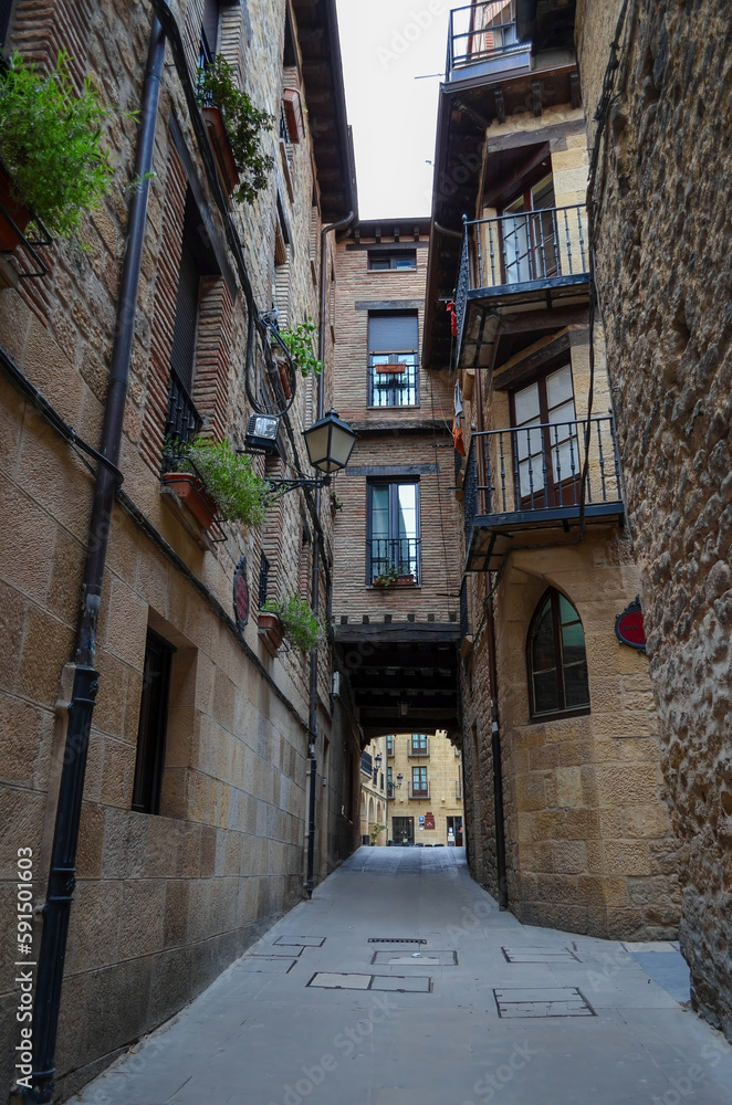 Narrow street with small balconies, in Laguardia, Alava, Spain.
