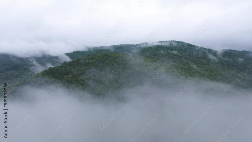 Fog over the misty mountains from the air Fog over the misty mountains from the air