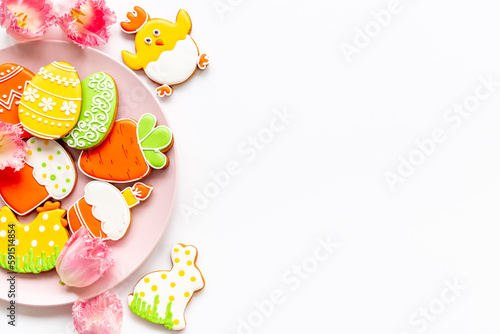 Happy Easter background with sweets and cookies eggs, top view