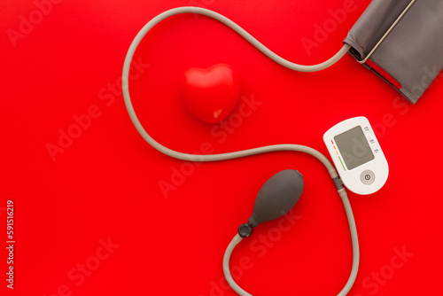 Red heart and blood pressure monitor. Heart diseases diagnosis concept