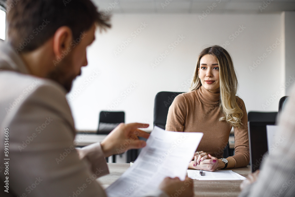 Happy female candidate on a job interview in the office. - obrazy, fototapety, plakaty 