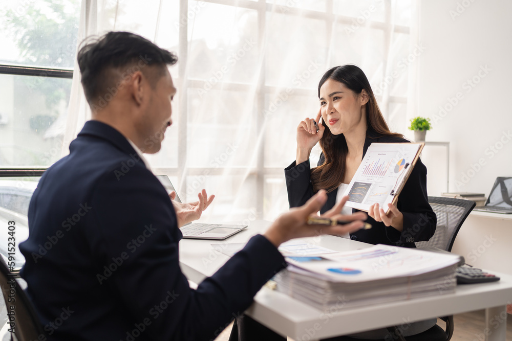 The couple of business talking about the project and make deal in the office. The couple of business talking about the project and make deal in the office.