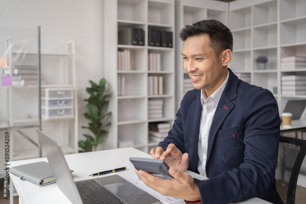 The couple of business employee working in the office with laptop and holding the coffee cup, happy, The couple of business employee working in the office with laptop and holding the coffee cup, happy,