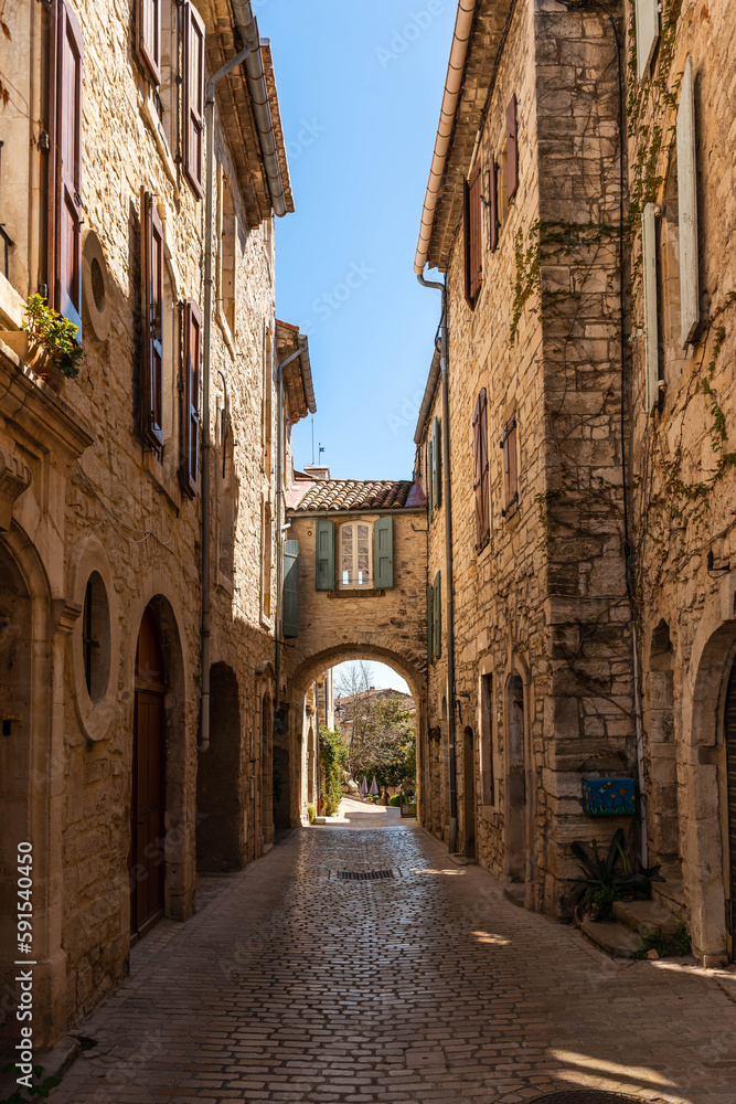 Street and passage in Vézénobres, a small medieval village in Gard, Occitanie, France