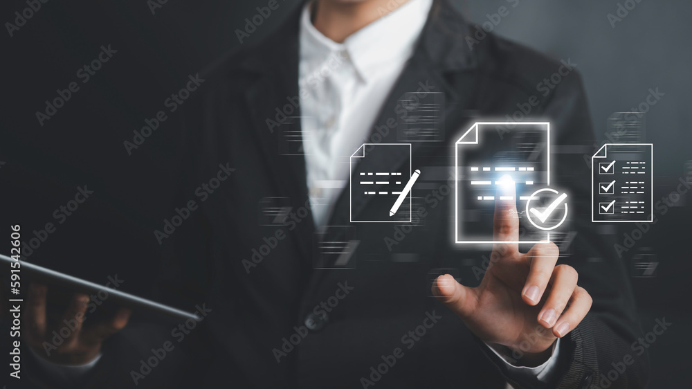 Foto de Businessman touch on symbol of check mark signifies that the ...