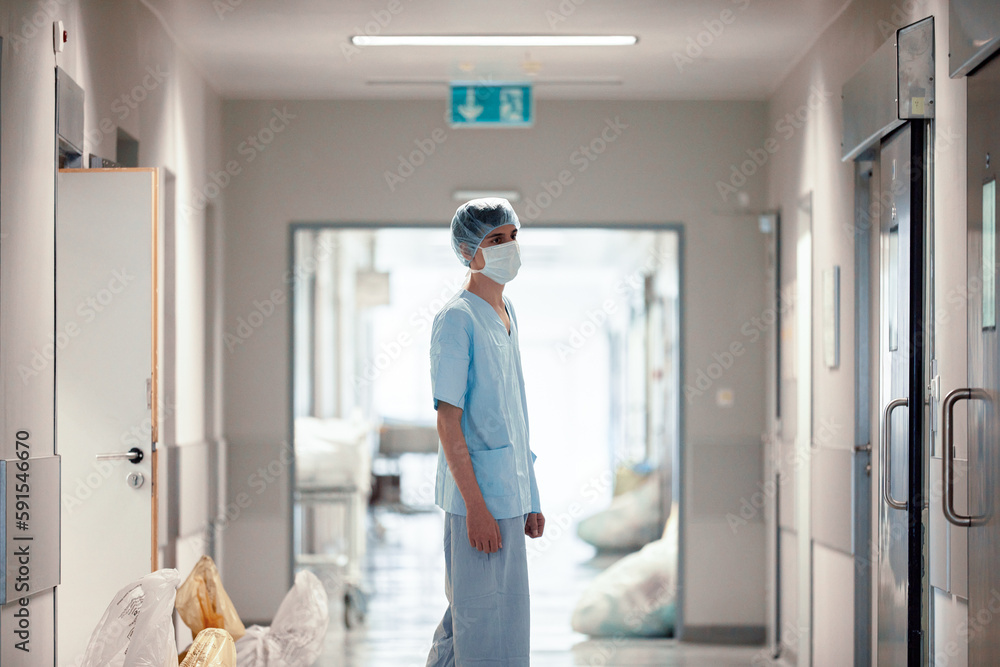 A tired surgeon leaves the operating room after the operation, a tired doctor, hard hard work, the work of doctors. A tired surgeon leaves the operating room after the operation, a tired doctor, hard hard work, the work of doctors.