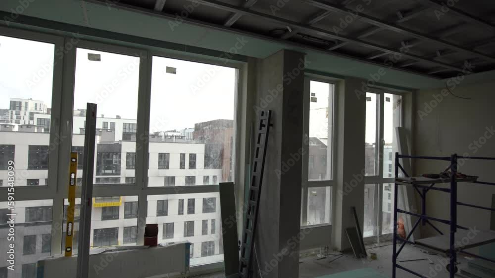 Ceiling installation with expert technicians In the room that is in the construction process Ceiling installation with expert technicians In the room that is in the construction process