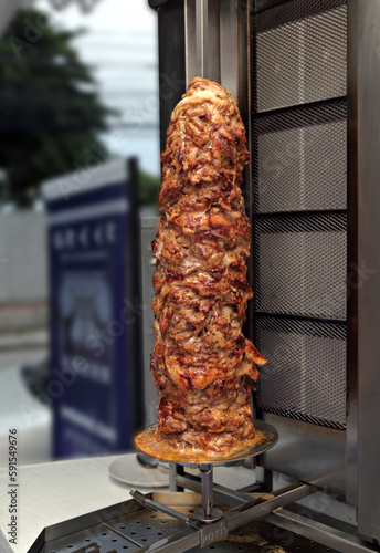 grilled chicken kebab meat on a grill turntable 