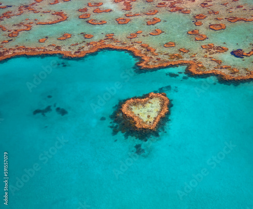 Heart Reef in the Whitsundays Queensland Australia. Famous reef that is shaped like a heart. The Great Barrier Reef aeria is heavily impacted by climate change.