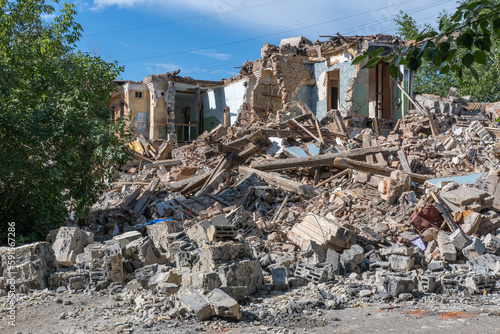 Landscape of ruined buildings, image of decrepitude or natural disaster. The house is destroyed.
