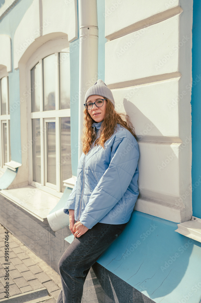 Portrait of a stylish woman in blue jacket. Spring outdoor portrait. Portrait of a stylish woman in blue jacket. Spring outdoor portrait.