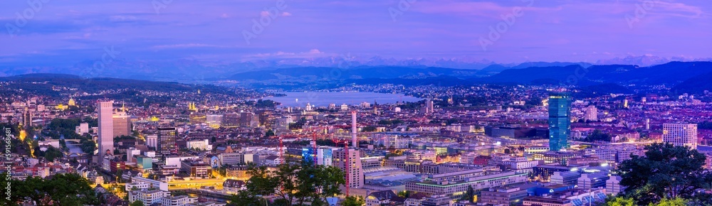 Zurich, Switzerland - July 7, 2022: Cityscape evening panorama of Zurich, the largest city in Switzerland. It is located in north-central Switzerland at the northwestern tip of Lake Zurich.