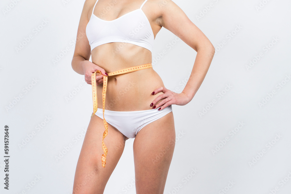 Cellulite removal on body girl. Woman with meter, body care. Plastic surgery concept. Cellulite removal on body girl. Woman with meter, body care. Plastic surgery concept.