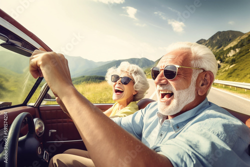 Old couple of husband and wife, enjoying retirement - they are riding a cabrio car while on a trip. Generative AI photo
