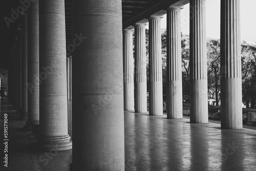 Black and white photo of Stoa of Attalos (covered walkway or portico) in the Agora of Athens, Greece. The current building was reconstructed by the american school