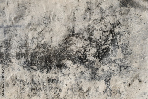Detail of damp stain on a lime washed wall. grunge background