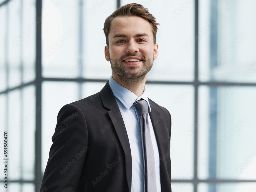 Portrait of a happy man wearing glasses and looking at the camera indoors. Portrait of a happy man wearing glasses and looking at the camera indoors.