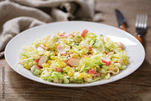 plate of salad with crab sticks, corn and vegetables
