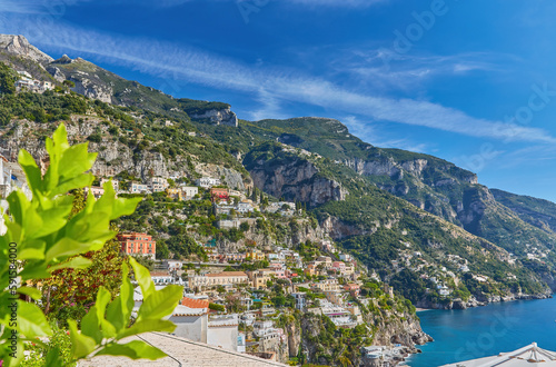 Fototapeta Naklejka Na Ścianę i Meble -  Panoramic view of Positano with comfortable beaches and blue sea on Amalfi Coast in Campania, Italy.