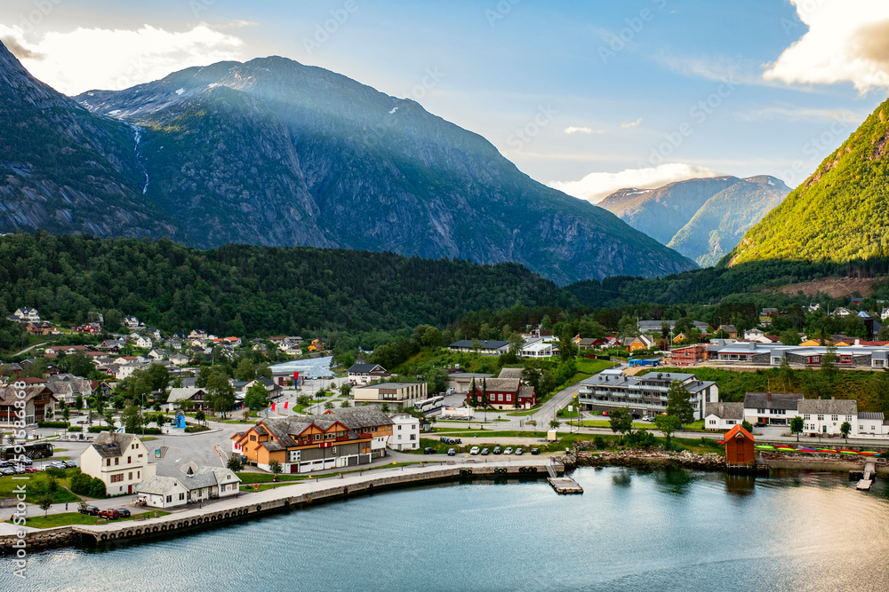 Amazing views of Norwegian fjord landscape with snow mountains from cruise ship sailing through the Eidfjord, Norway 