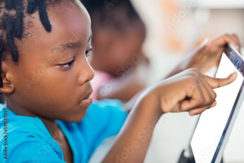 Young boy using digital tablet