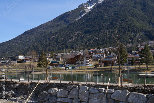 Kampl, Austria - March 16, 2023 - the Lake Kampler in an alpine valley Stubaital at the end of the winter season photo