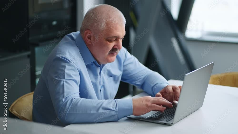 Elderly Man Learning To Use Laptop And Internet, Portrait Of Aged Person With PC In Home Elderly Man Learning To Use Laptop And Internet, Portrait Of Aged Person With PC In Home