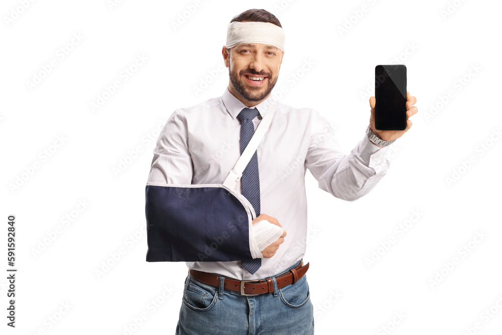 Young man with a broken arm and bandage on head showing a smartphone Young man with a broken arm and bandage on head showing a smartphone