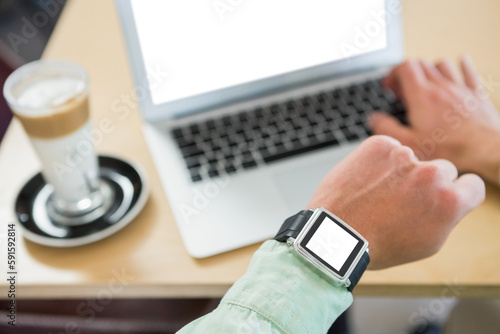 Cropped image of man wearing smart watch