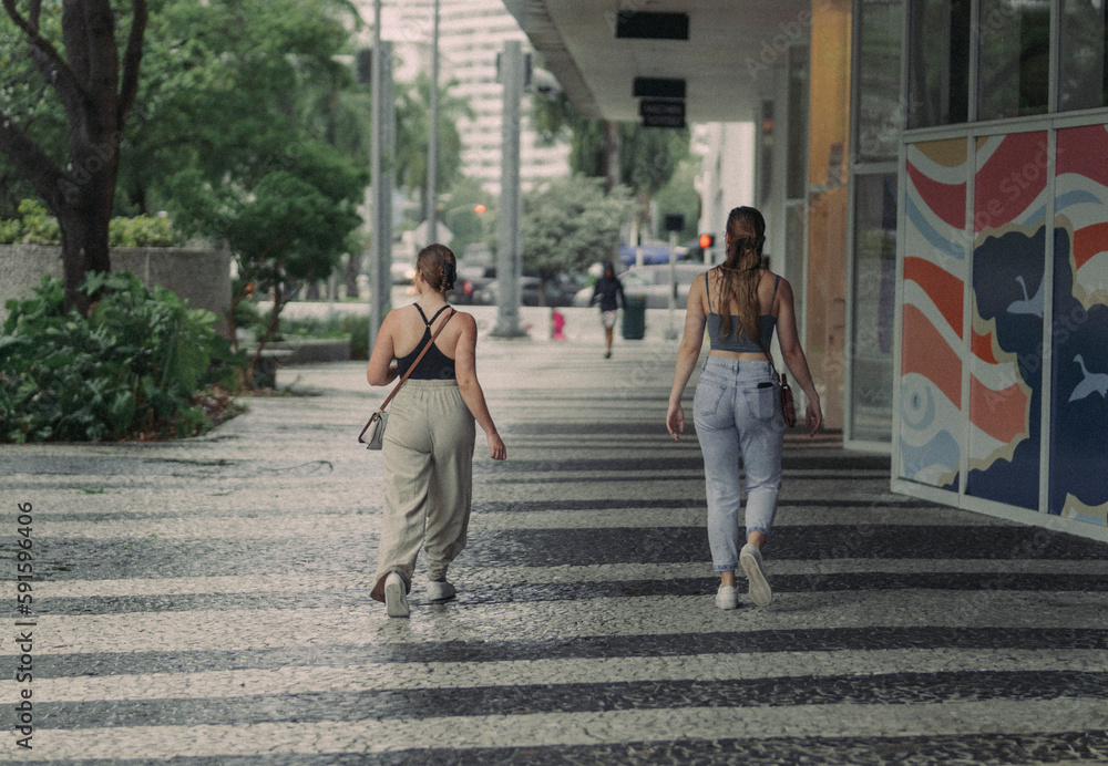 two women walking on the street Miami Beach  