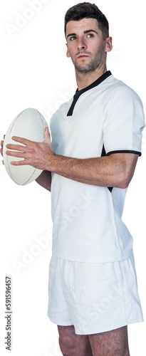 Focused rugby player holding ball