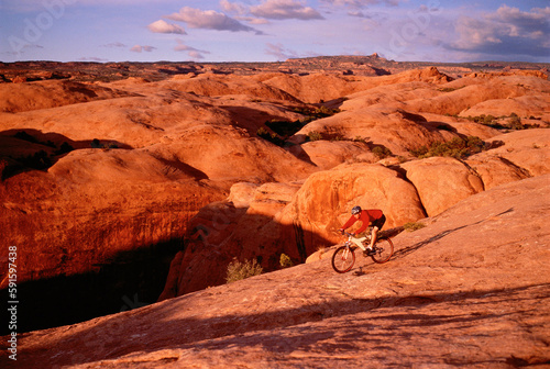 Man Cycling Moab, Utah, USA photo