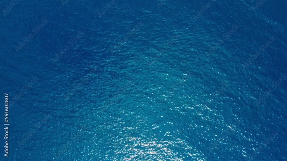 Aerial top down view from high altitude of blue azure turquoise sea water texture. a view of the water surface. Background of the water surface. 4k