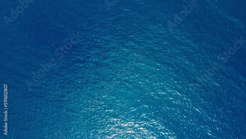 Aerial top down view from high altitude of blue azure turquoise sea water texture. a view of the water surface. Background of the water surface. 4k