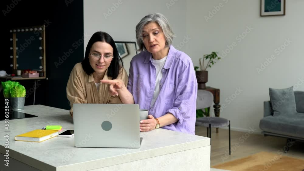 Caucasian grandchild and grandmother enjoying online web communication via media application on modern laptop computer,happy offspring family using netbook device for video calling and talking in home Caucasian grandchild and grandmother enjoying online web communication via media application on modern laptop computer,happy offspring family using netbook device for video calling and talking in home