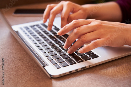 Close-up of the hands of businesswoman typing with a laptop © sergiocerveraphoto