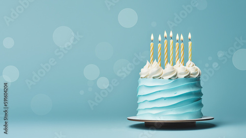Blue birthday cake with yellow birthday candles on a blue background