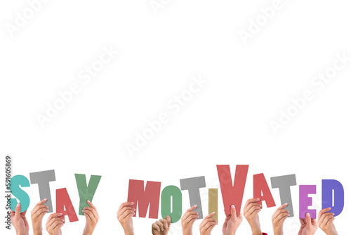 Colorful alphabet spelling stay motivated held up by people 