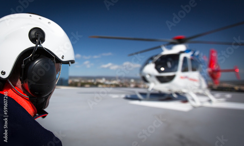 Modern medical helicopter on a hospital rooftop helipad photo