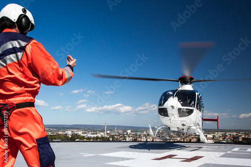 Modern medical helicopter on a hospital rooftop helipad photo