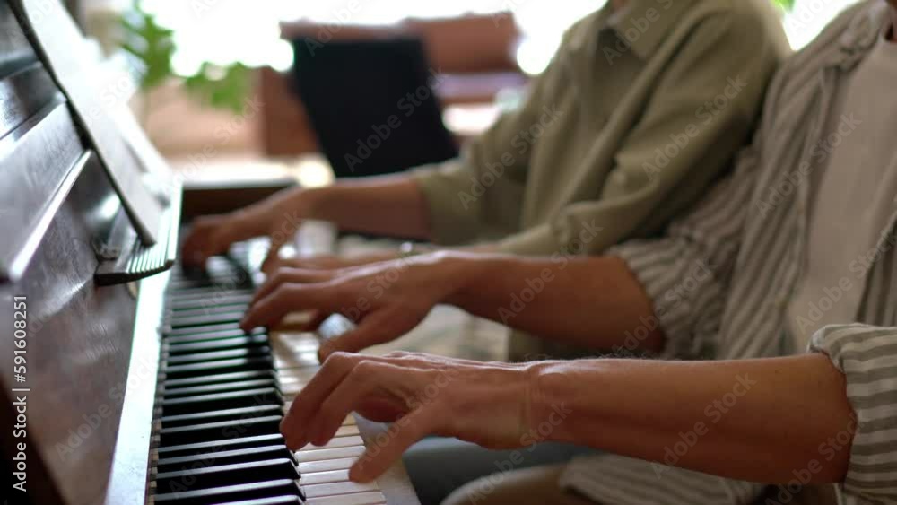 Couple of composers creating song sound during together time spending in hobby studio with piano instrument, man and woman playing music melody typing on keyboard
Couple of composers creating song sound during together time spending in hobby studio with piano instrument, man and woman playing music melody typing on keyboard