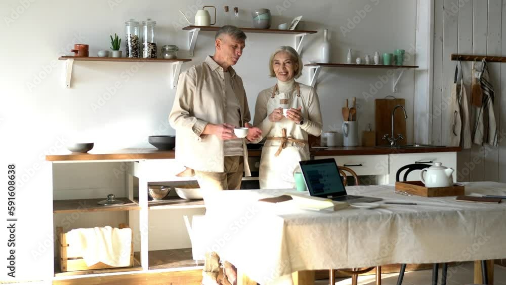 Mature Caucasian couple in love spending time at homey kitchen for drinking hot tea and bonding during weekend time, happy marriage of husband and wife communicate indoors
Mature Caucasian couple in love spending time at homey kitchen for drinking hot tea and bonding during weekend time, happy marriage of husband and wife communicate indoors